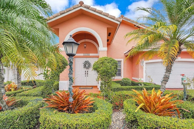 doorway to property featuring a garage