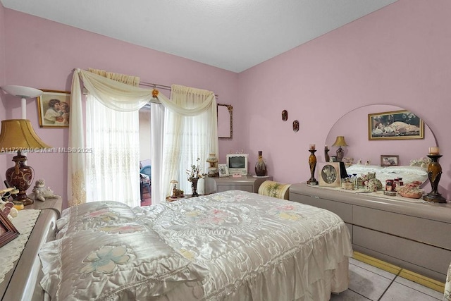 bedroom featuring light tile patterned flooring