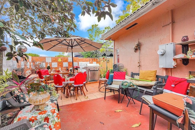 view of patio with a grill