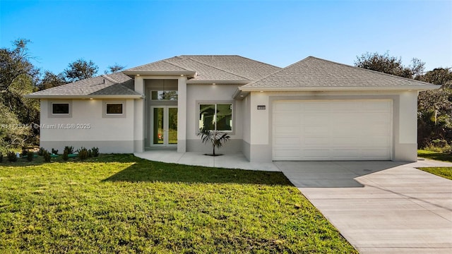 prairie-style house with a front lawn and a garage