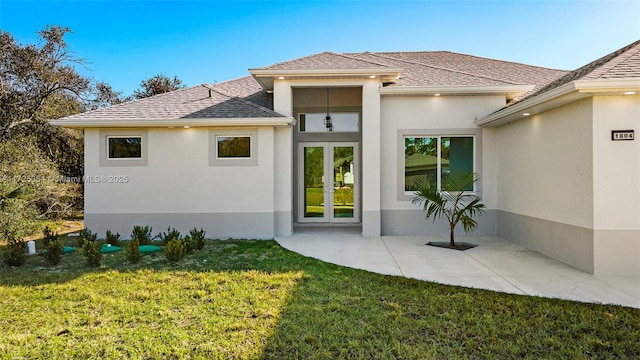 back of house featuring a yard and a patio