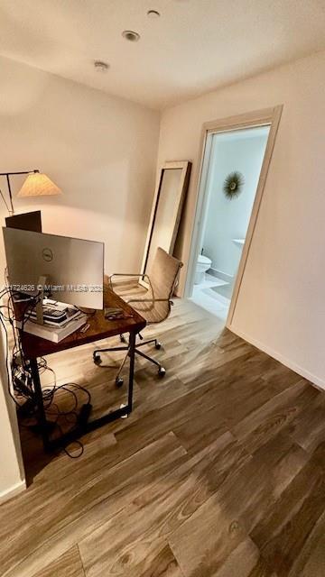 office area with hardwood / wood-style floors