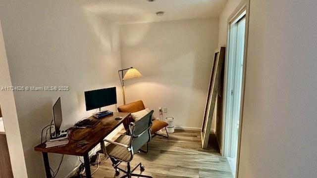 801 S Miami Ave Unit 4706, Miami, FL 33130 - office area with wood finished floors and baseboards