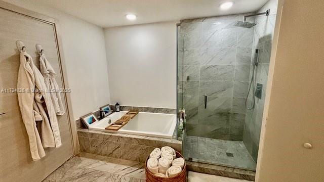 801 S Miami Ave Unit 4706, Miami, FL 33130 - full bathroom with a stall shower, a bath, and recessed lighting