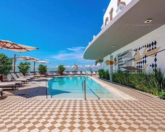 view of swimming pool with a patio area