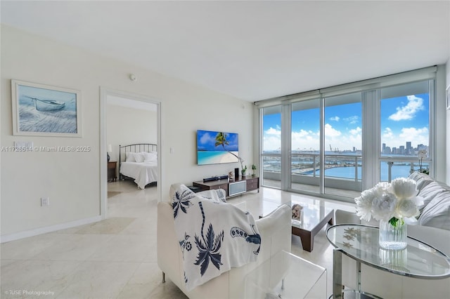 tiled living room with a wall of windows