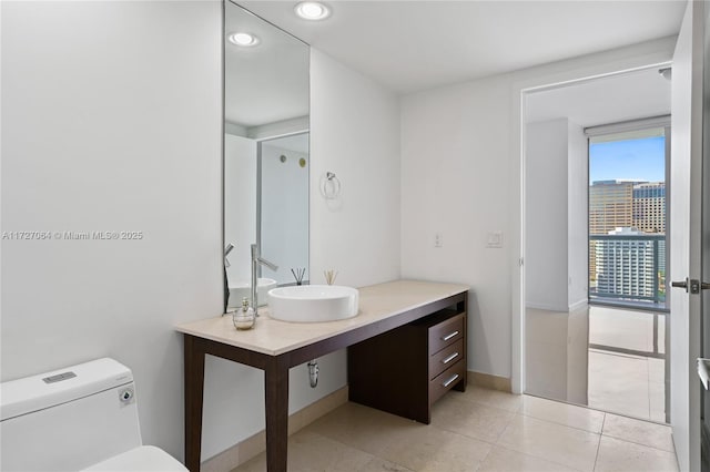 bathroom with sink, tile patterned floors, and toilet