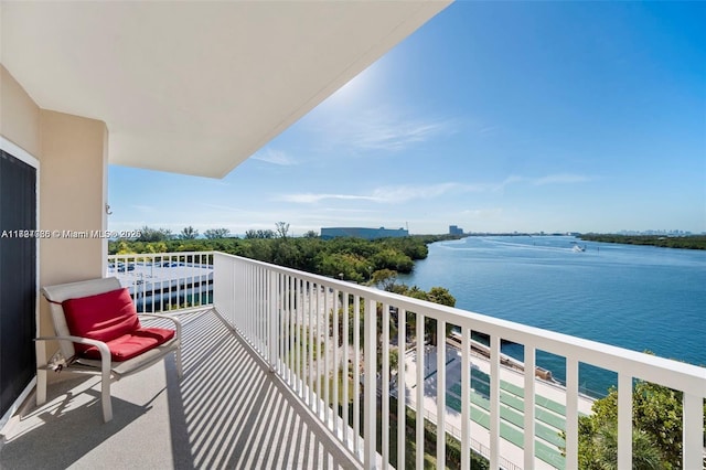 balcony featuring a water view