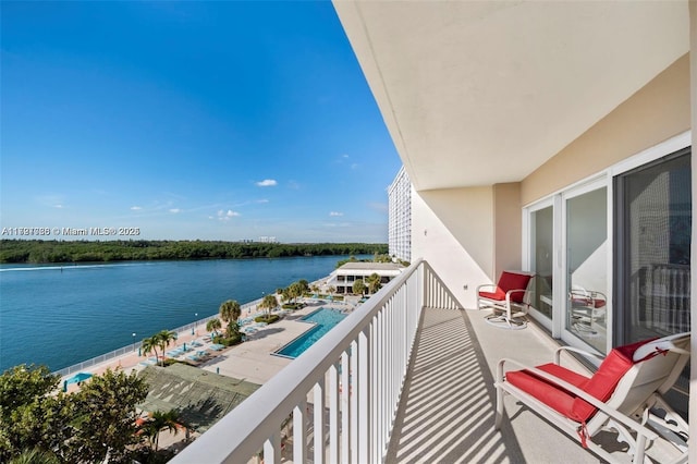 balcony featuring a water view