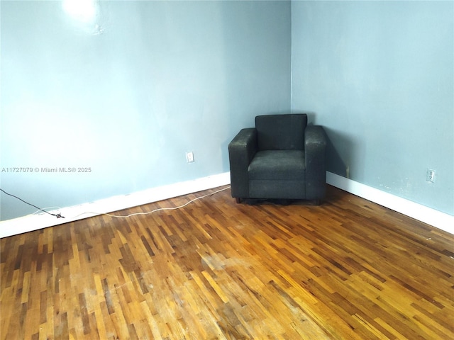 unfurnished room featuring hardwood / wood-style flooring