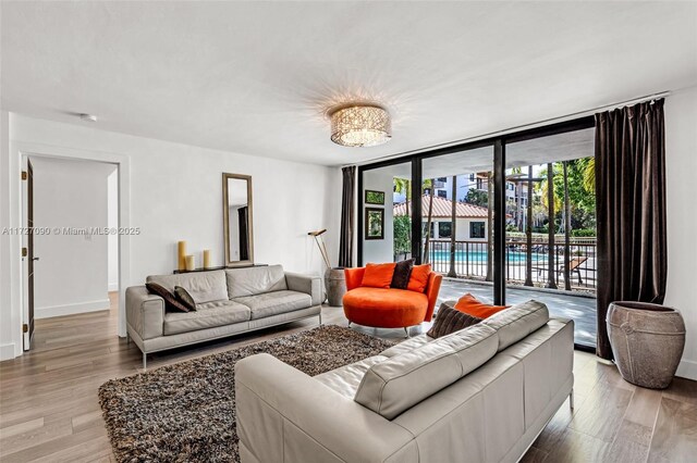 living room featuring hardwood / wood-style flooring and expansive windows