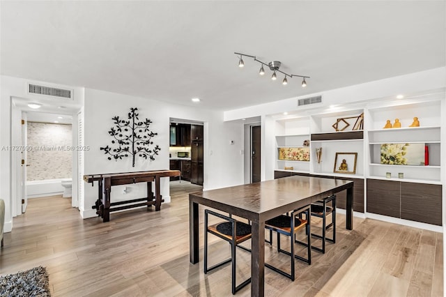 dining area with light wood-type flooring