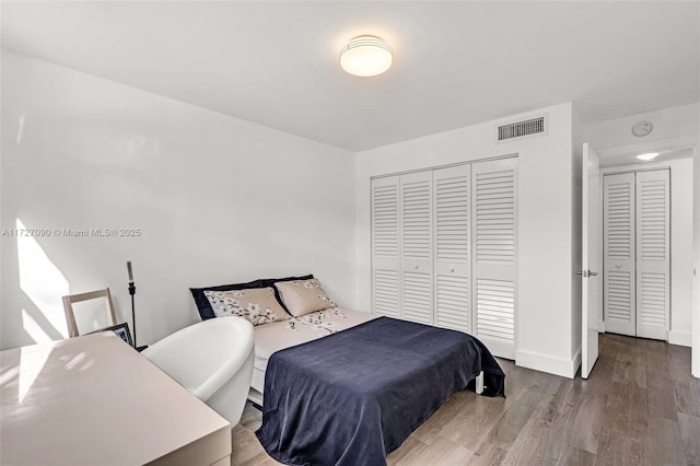 bedroom featuring light hardwood / wood-style floors and a closet