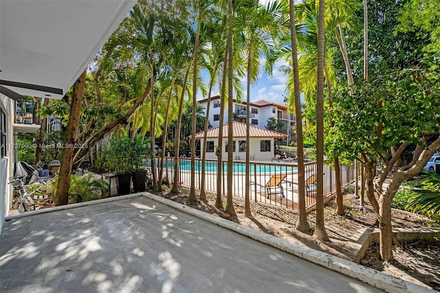 view of swimming pool with a patio