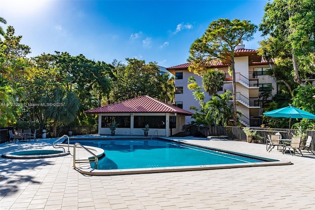 view of pool featuring a gazebo, a hot tub, and a patio