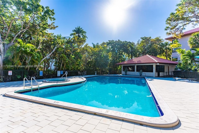 view of swimming pool with a patio