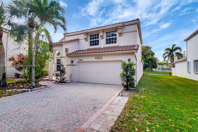 view of front of property with a garage