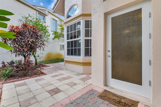 doorway to property featuring a patio area