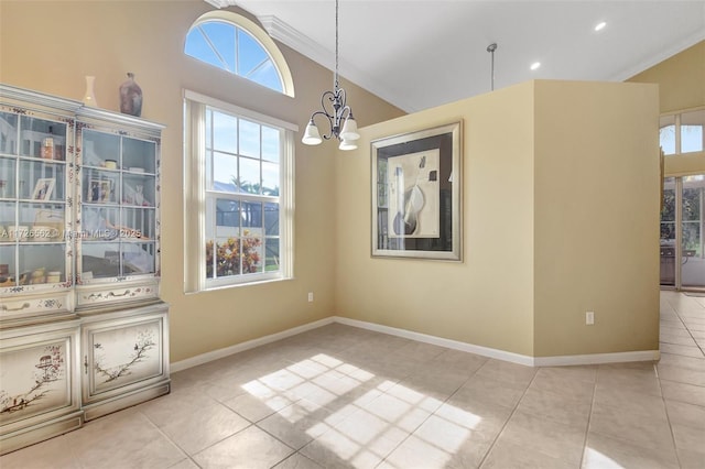 unfurnished dining area featuring an inviting chandelier, vaulted ceiling, and light tile patterned floors