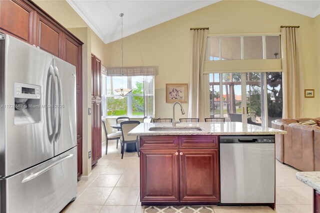 kitchen with light stone counters, light tile patterned floors, tasteful backsplash, and stainless steel appliances