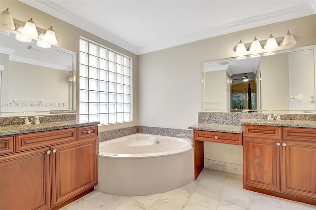 bathroom with vanity, crown molding, and a bathing tub