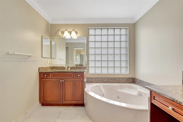 bathroom with crown molding, vanity, and a bathtub