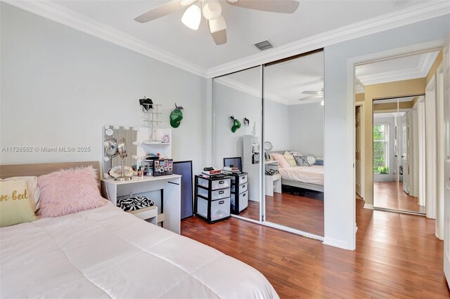 bedroom featuring ceiling fan, ornamental molding, and light hardwood / wood-style floors