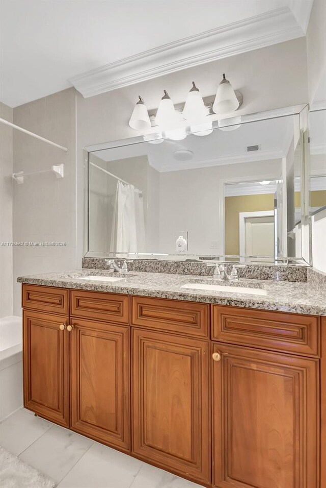 bathroom with shower / tub combo with curtain, vanity, and ornamental molding