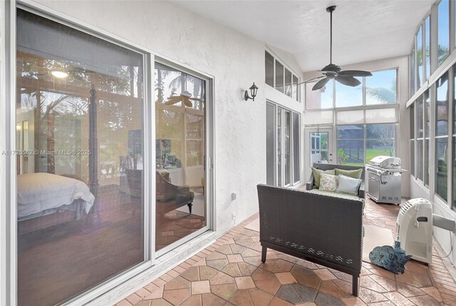 sunroom / solarium with ceiling fan