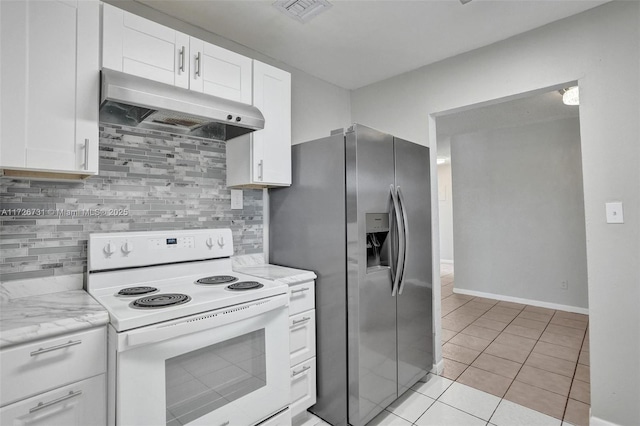 kitchen featuring tasteful backsplash, white range with electric stovetop, stainless steel refrigerator with ice dispenser, light tile patterned floors, and white cabinets