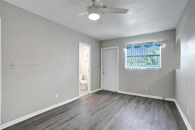 empty room featuring ceiling fan and wood-type flooring