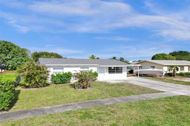 ranch-style house featuring a carport and a front yard