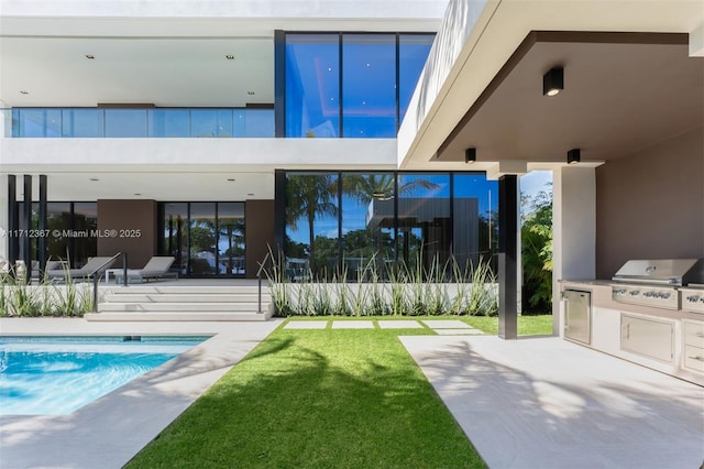 exterior space with a fenced in pool and area for grilling