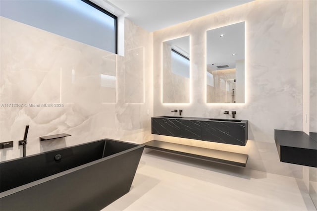 bathroom with vanity and a bathing tub