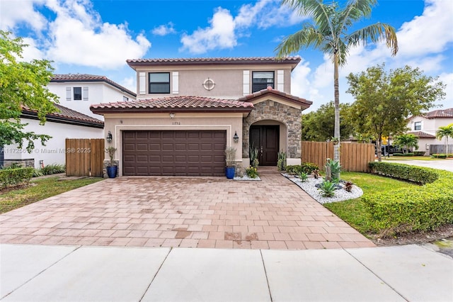 mediterranean / spanish-style home featuring a garage