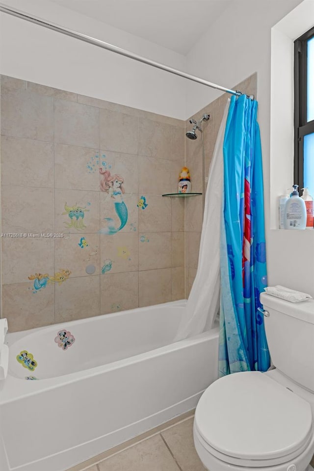 bathroom featuring toilet, tile patterned flooring, and shower / tub combo with curtain