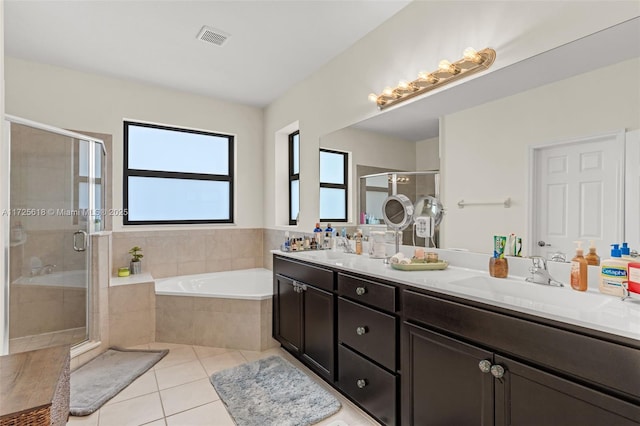 bathroom with separate shower and tub, vanity, and tile patterned flooring