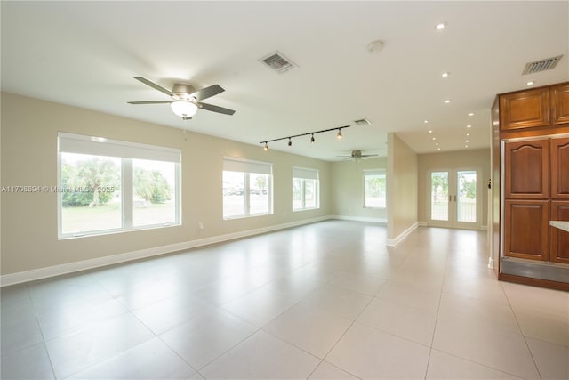 unfurnished room featuring recessed lighting, rail lighting, visible vents, and baseboards