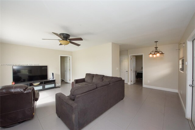 living room with ceiling fan and light tile patterned floors