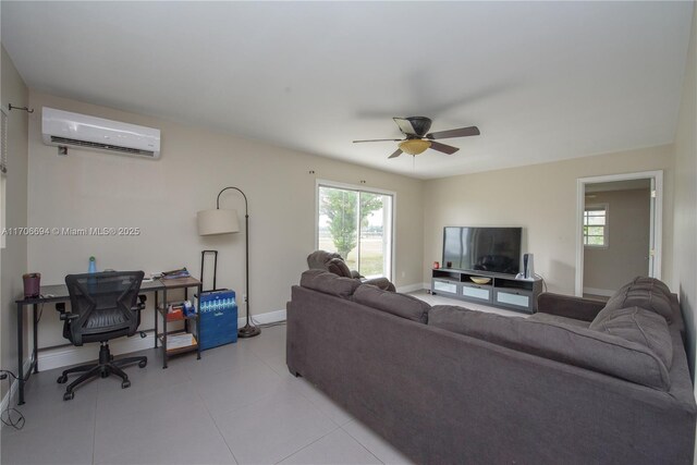 living room featuring ceiling fan and a wall mounted AC