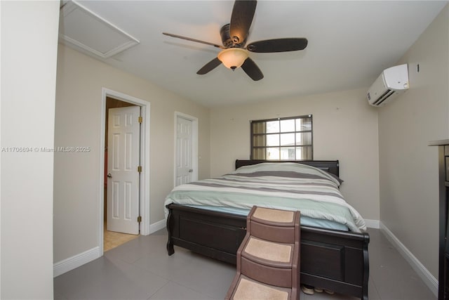 bedroom featuring an AC wall unit, tile patterned floors, a ceiling fan, and baseboards