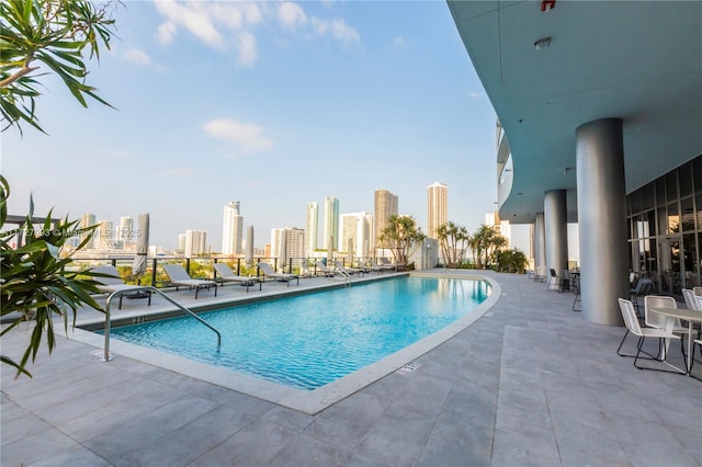 view of swimming pool with a patio