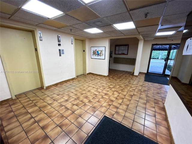 interior space featuring a paneled ceiling