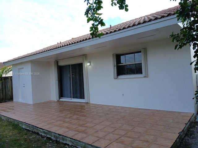 rear view of house featuring a patio