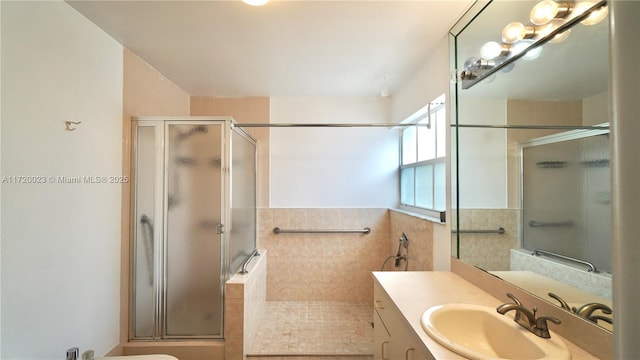 bathroom with an enclosed shower and vanity