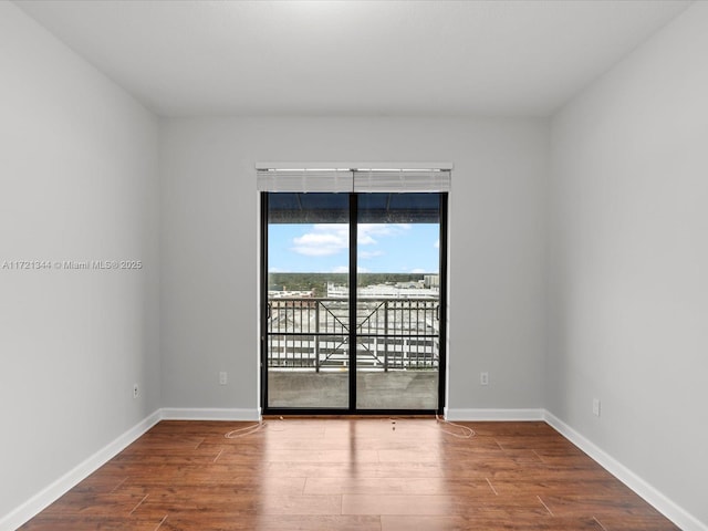 unfurnished room featuring hardwood / wood-style floors