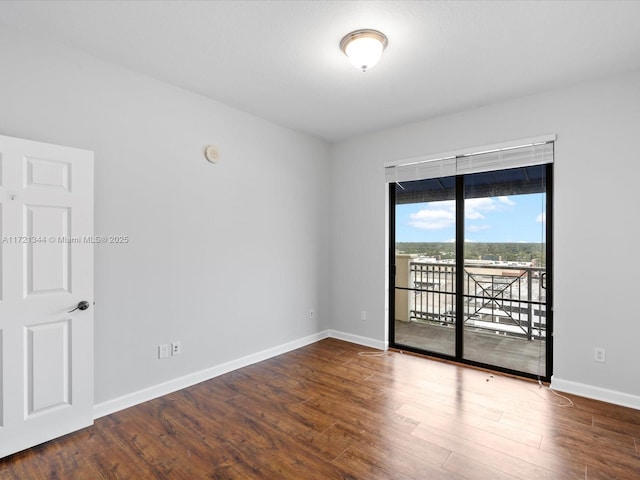 spare room featuring hardwood / wood-style flooring