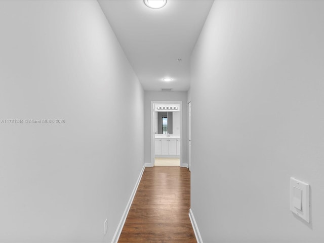 hall with dark hardwood / wood-style flooring