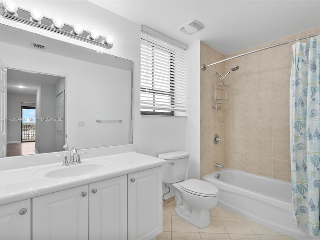 full bathroom with toilet, shower / tub combo, tile patterned flooring, and vanity