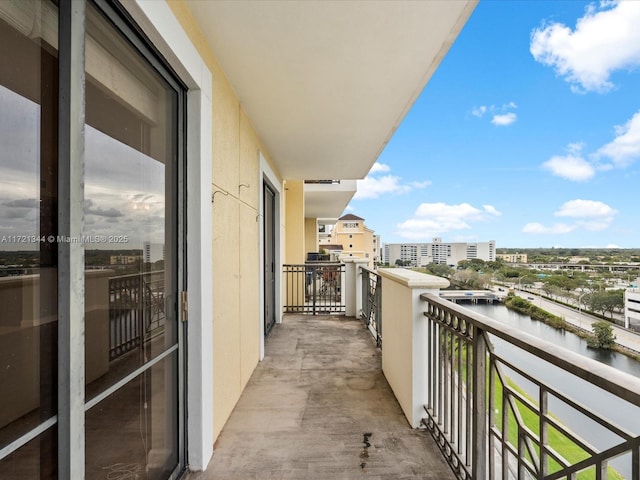 balcony featuring a water view